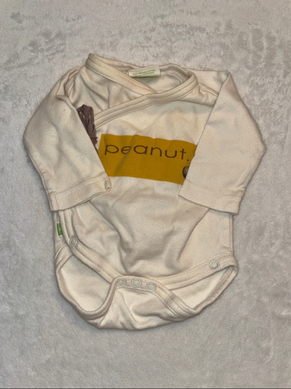 Parade Cream Baby Onesie with Mustard "peanut" Graphic